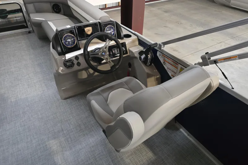 Slide: The Image of Underneath view of a 2026 Premier 200 Sunscape pontoon boat on gravel. - 11