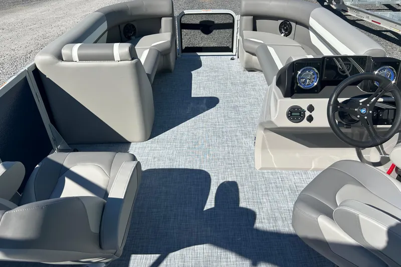 Slide: The Image of 2026 Premier 200 Sunscape boat interior with gray seating and modern dashboard. - 16