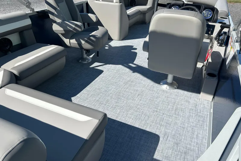 Slide: The Image of Interior of 2026 Premier 200 Sunscape boat with gray seating and flooring. - 21