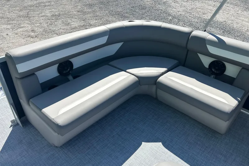 Slide: The Image of 2026 Premier 200 Sunscape boat seating with gray upholstery and integrated speakers. - 22