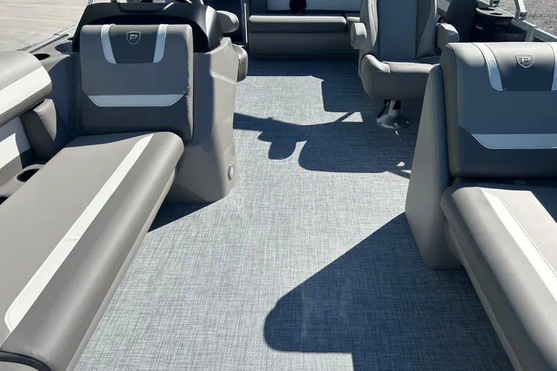 Slide: The Image of Interior of 2026 Premier 200 Sunscape boat with gray seating and flooring. - 23