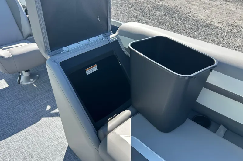 Slide: The Image of 2026 Premier 200 Sunscape boat seat with integrated storage and trash bin. - 24