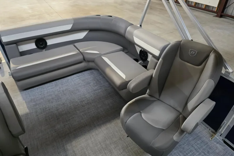 Slide: The Image of 2026 Premier 200 Sunscape pontoon boat on gravel, front view. - 9