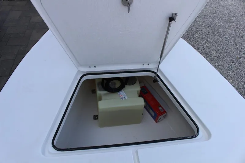 Slide: The Image of Open storage compartment on Delta D18 boat, 2026 model, showing interior contents. - 8
