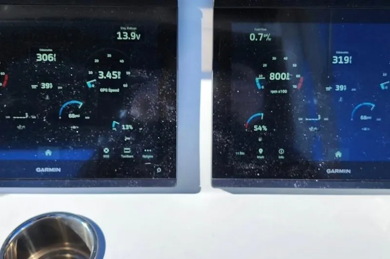 Slide: The Image of Garmin displays on Walker Bay WB 22 boat, showing speed, voltage, and fuel data. - 3