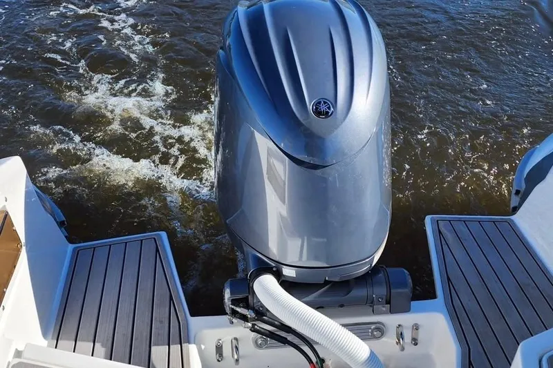 Slide: The Image of 2023 Walker Bay WB 22 boat with Yamaha outboard motor on water. - 4