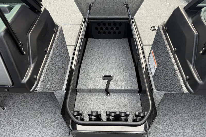 Slide: The Image of 2026 Lund 2075 Impact XS boat interior storage compartment, open and empty. - 18