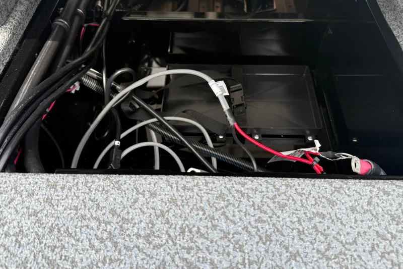 Slide: The Image of 2026 Lund 2075 Impact XS boat wiring and battery compartment. - 29