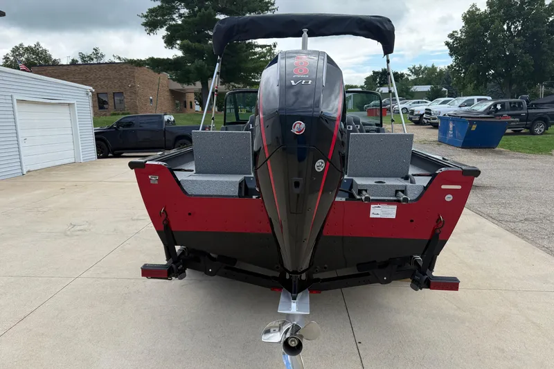 Slide: The Image of 2026 Lund 2075 Impact XS boat with powerful V8 engine, parked outdoors. - 6