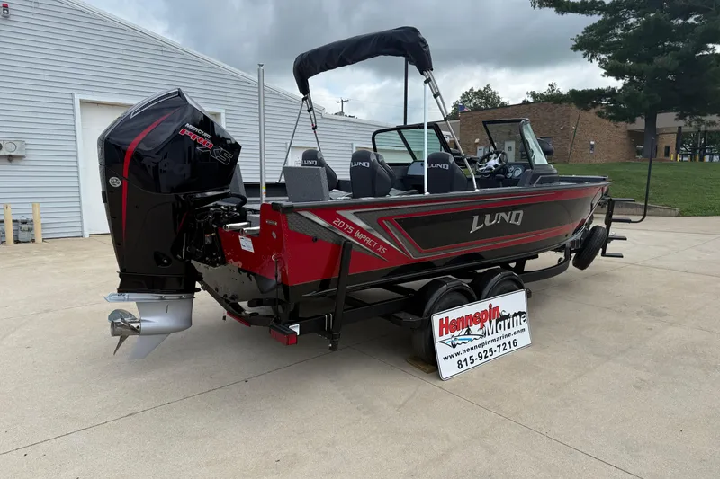 Slide: The Image of 2026 Lund 2075 Impact XS boat with Mercury engine at Hennepin Marine dealership. - 7