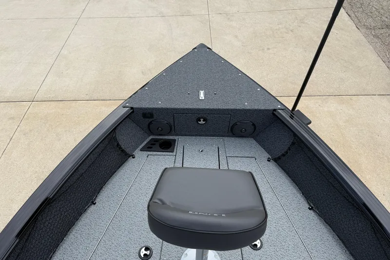 Slide: The Image of 2026 Lund 2075 Impact XS boat interior with seating and storage compartments. - 9