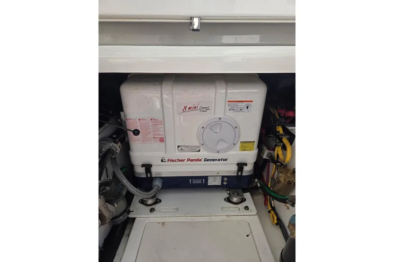 Slide: The Image of Fischer Panda generator in 2020 Pursuit DC 365 Dual Console boat engine compartment. - 23