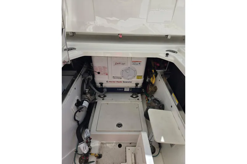 Slide: The Image of 2020 Pursuit DC 365 Dual Console engine compartment with Fischer Panda generator. - 24