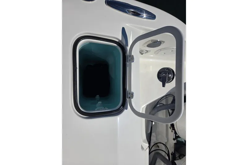 Slide: The Image of Open hatch on 2020 Pursuit DC 365 Dual Console boat, showcasing interior compartment. - 33