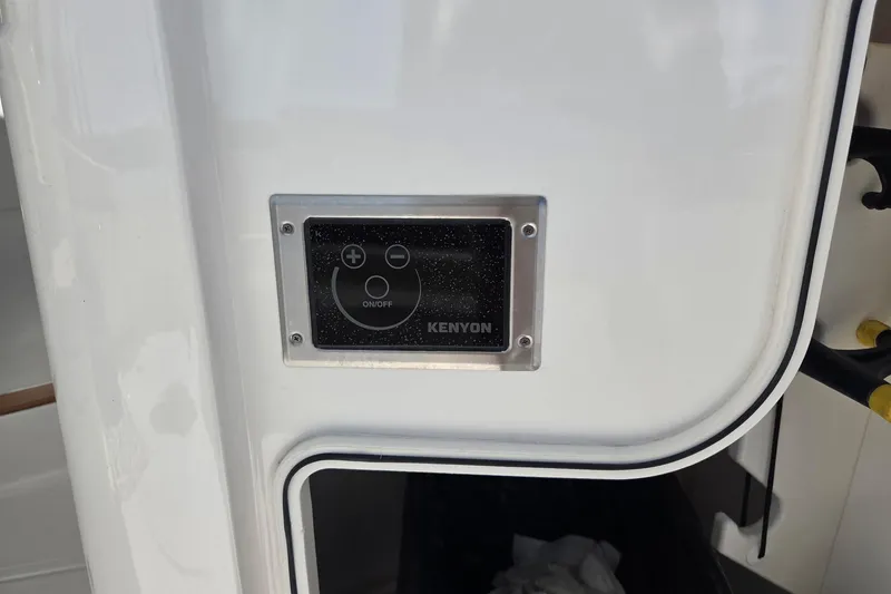 Slide: The Image of Control panel on 2020 Pursuit DC 365 Dual Console boat, featuring Kenyon interface. - 34