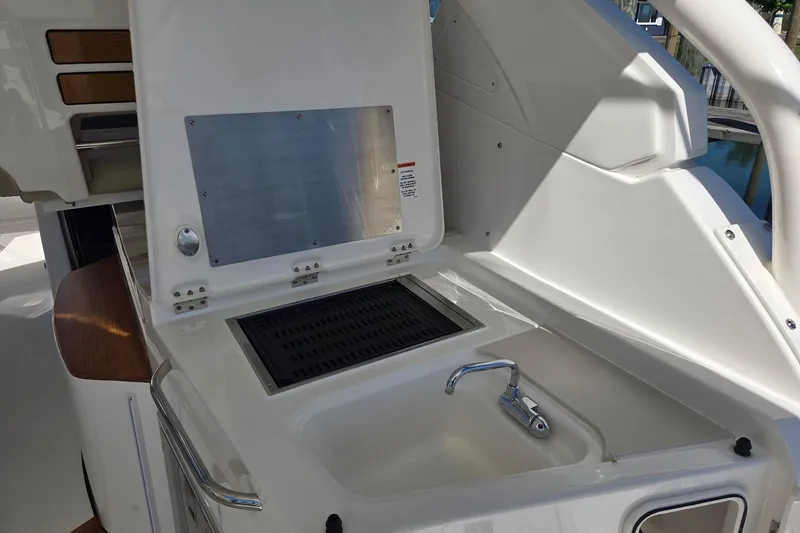 Slide: The Image of 2020 Pursuit DC 365 Dual Console boat with sink and grill station. - 36
