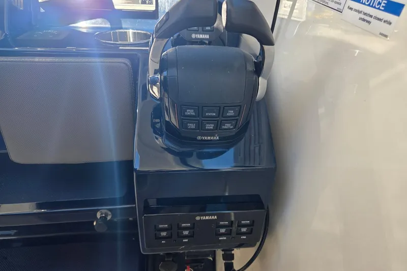 Slide: The Image of Control panel of a 2020 Pursuit DC 365 Dual Console boat with Yamaha throttle. - 45
