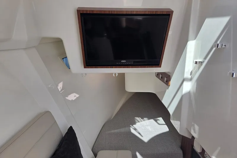 Slide: The Image of 2020 Pursuit DC 365 Dual Console interior with TV and seating area. - 70