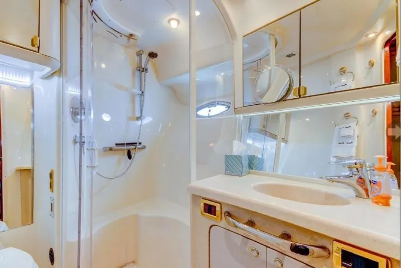 Slide: The Image of Luxurious bathroom in 2002 Sea Ray 550 Sedan Bridge yacht with shower and vanity. - 12