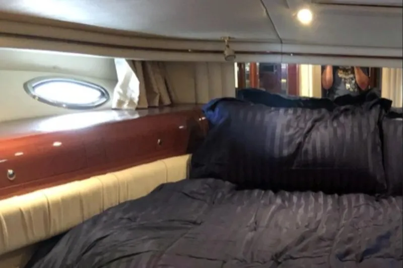 Slide: The Image of Luxurious bedroom interior of 2002 Sea Ray 550 Sedan Bridge yacht. - 15