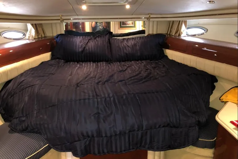Slide: The Image of Luxurious bedroom interior of 2002 Sea Ray 550 Sedan Bridge yacht. - 16