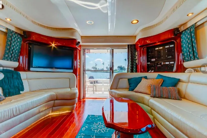 Slide: The Image of Luxurious 2002 Sea Ray 550 Sedan Bridge yacht interior with plush seating and elegant decor. - 18