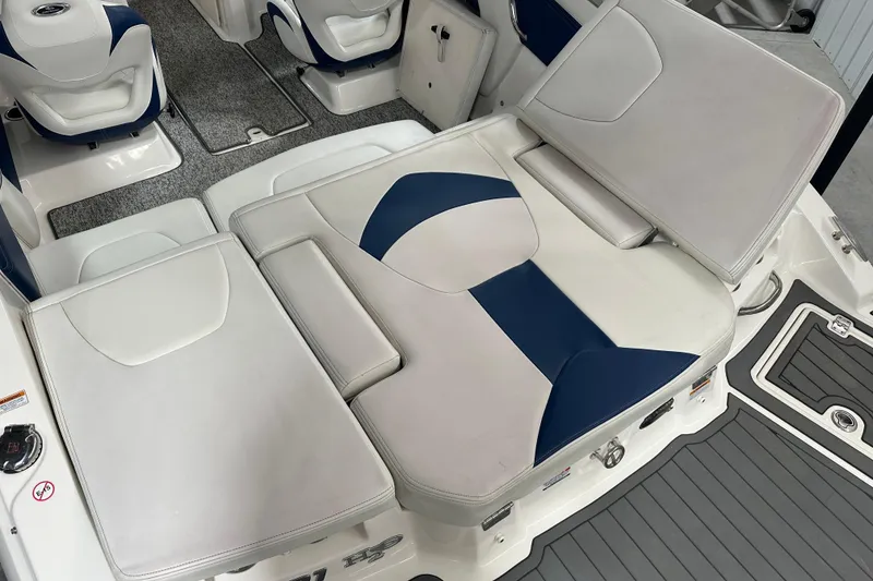 Slide: The Image of 2018 Chaparral 21 H2O Sport boat interior with white and blue seating. - 4