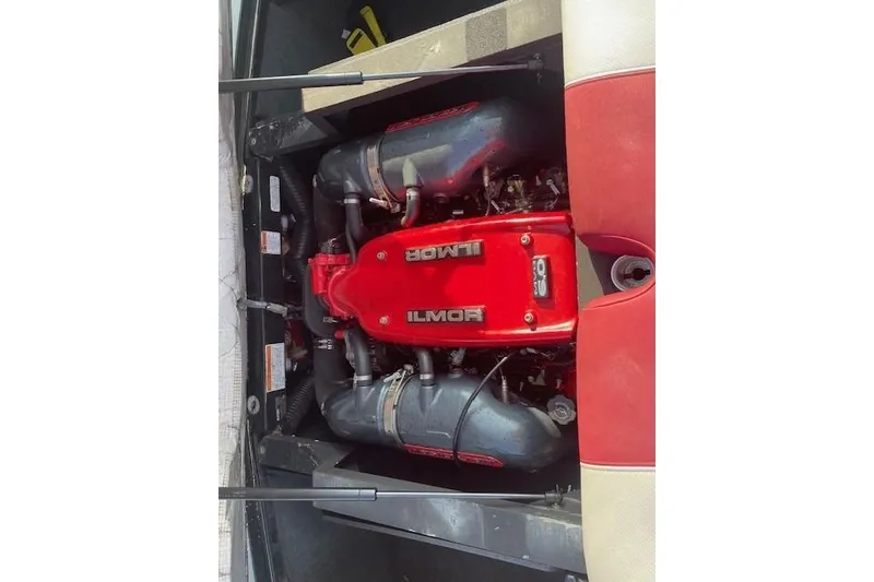 Slide: The Image of 2013 MasterCraft X-25 boat engine with red and white seating. - 10