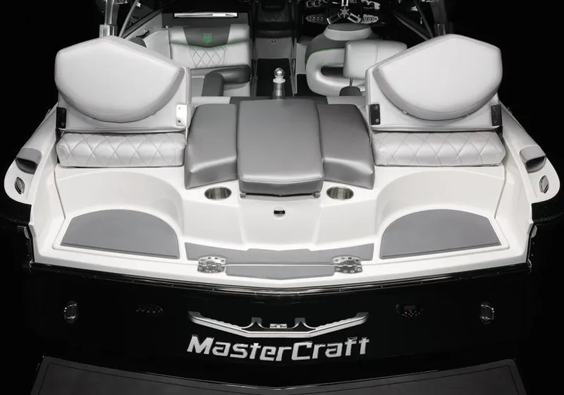 Slide: The Image of 2013 MasterCraft X-25 boat interior with gray seating and sleek design. - 27