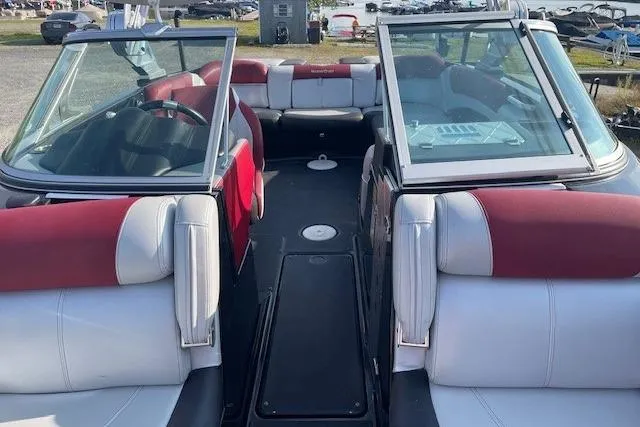 Slide: The Image of 2013 MasterCraft X-25 boat interior with red and gray seating. - 4