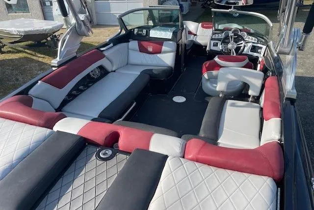 Slide: The Image of 2013 MasterCraft X-25 boat interior with red and white seating. - 6