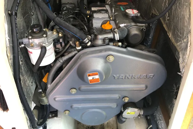 Slide: The Image of Yanmar engine in a 2008 Catalina 42 MkII sailboat, showcasing detailed components. - 12