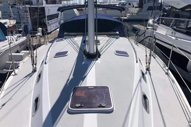 Slide: The Image of 2008 Catalina 42 MkII sailboat deck view at marina, showcasing sleek design and rigging. - 14