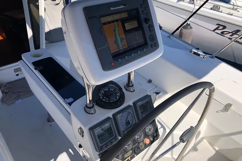 Slide: The Image of Cockpit of 2008 Catalina 42 MkII sailboat with navigation equipment and steering wheel. - 17