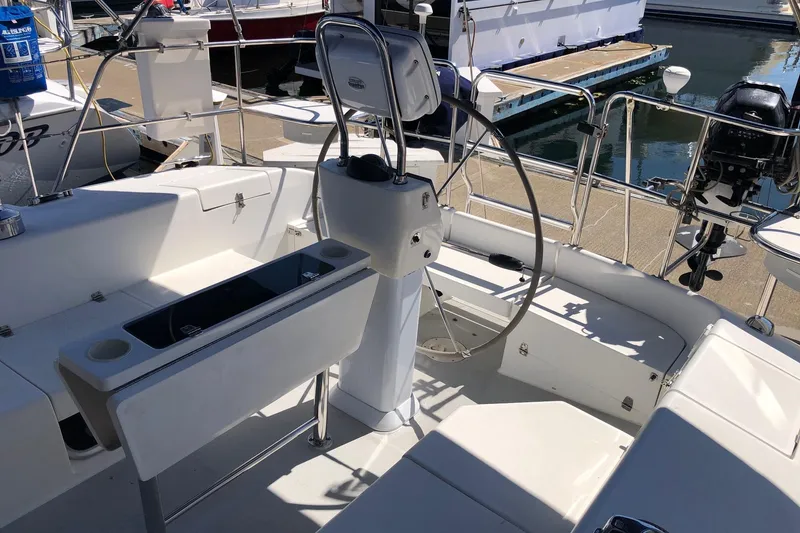 Slide: The Image of Cockpit of 2008 Catalina 42 MkII sailboat with steering wheel and seating. - 18