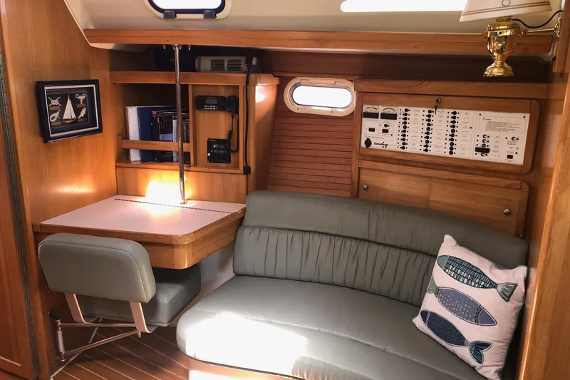 Slide: The Image of Cozy interior of 2008 Catalina 42 MkII sailboat with navigation station and seating area. - 3