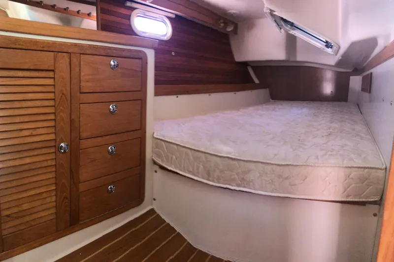 Slide: The Image of 2008 Catalina 42 MkII cabin interior with wooden cabinetry and comfortable bed. - 7