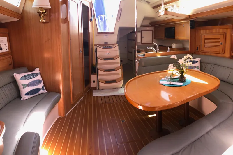 Slide: The Image of Luxurious interior of a 2008 Catalina 42 MkII sailboat with elegant wood finishes. - 9