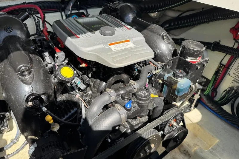 Slide: The Image of Engine compartment of a 2015 Formula 310 Bowrider boat, showcasing detailed components. - 14