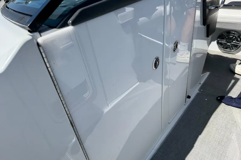 Slide: The Image of 2015 Formula 310 Bowrider interior, featuring sleek white paneling and modern design elements. - 21