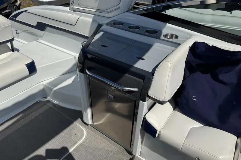Slide: The Image of 2015 Formula 310 Bowrider interior with seating and built-in storage. - 23