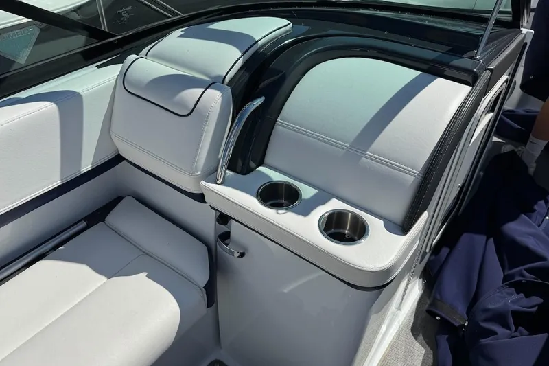 Slide: The Image of 2015 Formula 310 Bowrider interior with white seating and cup holders. - 26