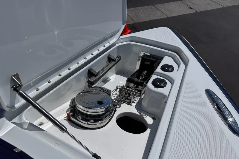 Slide: The Image of 2015 Formula 310 Bowrider anchor compartment with open hatch and winch system. - 28