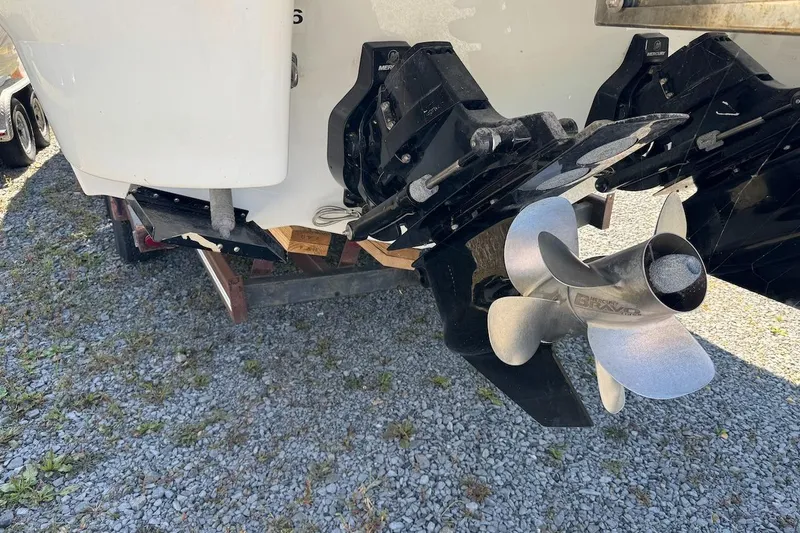 Slide: The Image of 2015 Formula 310 Bowrider boat propeller and stern on gravel surface. - 3