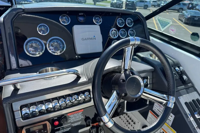 Slide: The Image of Dashboard of a 2015 Formula 310 Bowrider boat with Garmin navigation system. - 6