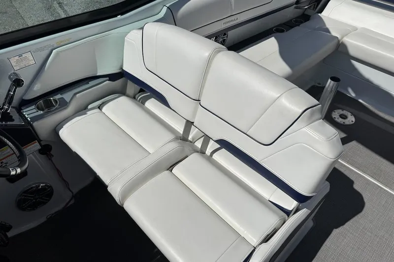 Slide: The Image of 2015 Formula 310 Bowrider interior with white leather seating and modern design. - 8