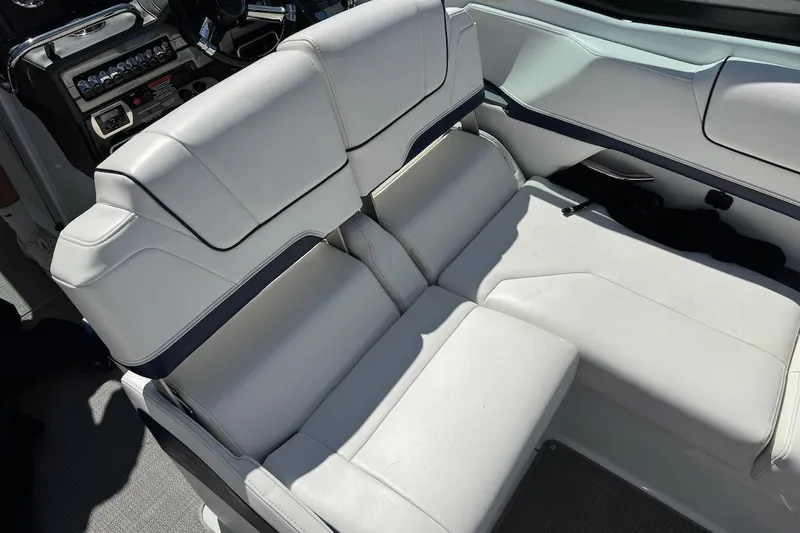 Slide: The Image of 2015 Formula 310 Bowrider interior with white leather seating and control panel. - 9