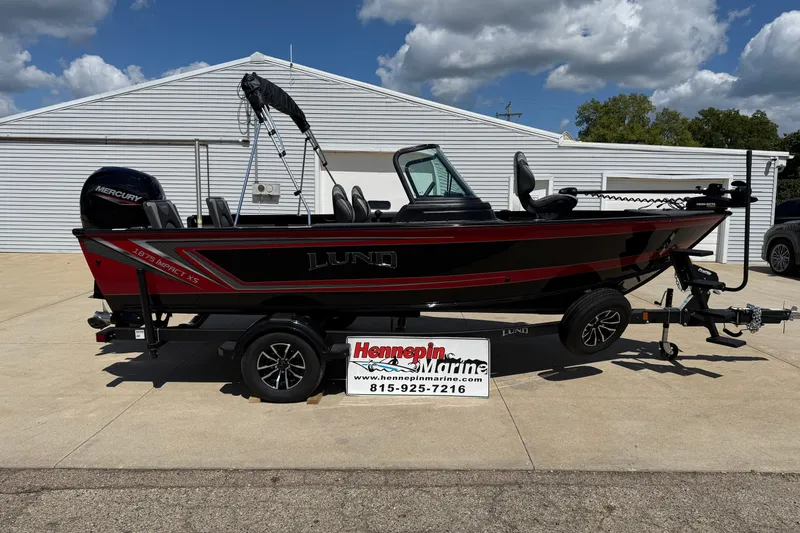 The Image of 2026 Lund 1875 Impact XS Sport boat on trailer, displayed at Hennepin Marine. - 1
