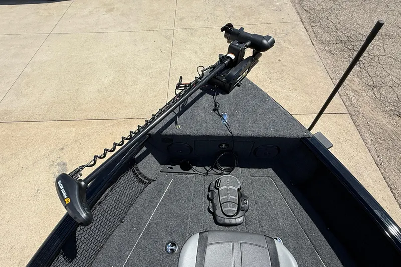 Slide: The Image of 2026 Lund 1875 Impact XS Sport boat deck with trolling motor and control panel. - 11