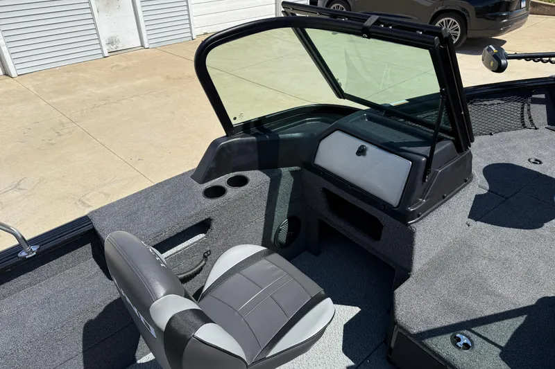 Slide: The Image of 2026 Lund 1875 Impact XS Sport boat interior with seating and console. - 20